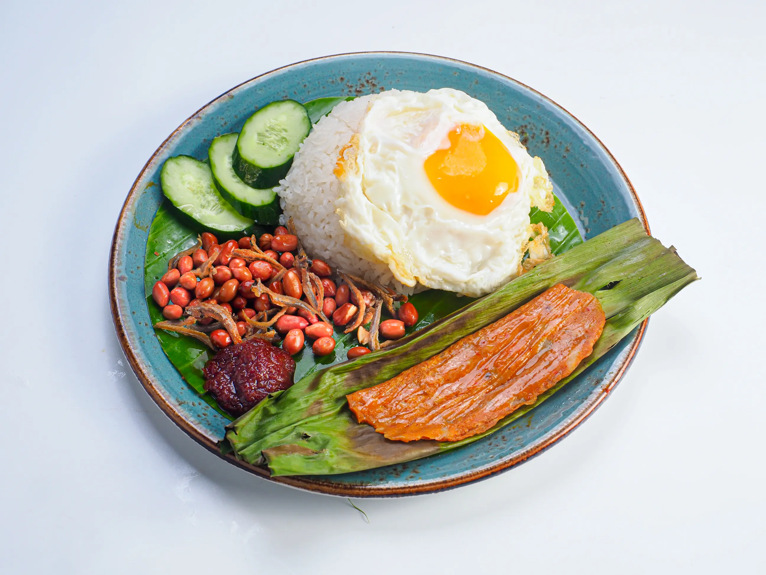 Nasi lemak fried egg sambal blue plate food photography Singapore